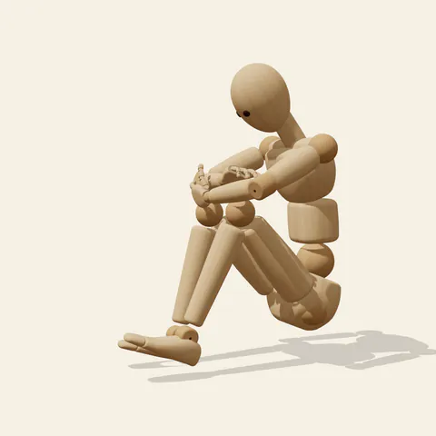 Arms over Knees pose reference, side view of a wooden drawing mannequin